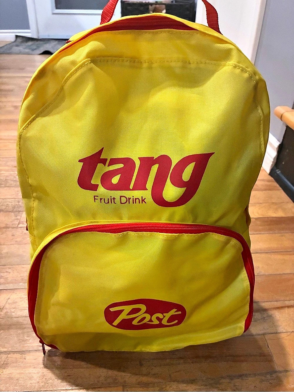Tang Fruit Drink Graphic Backpack in Yellow & Red